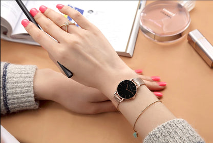 Women's watch with Japanese quartz movement, simple design in gold-tone stainless steel