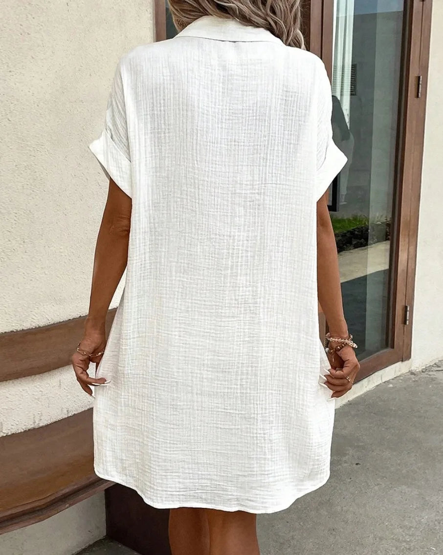 Women's dress, plain with a fold-down collar, single-breasted closure, and loose fit